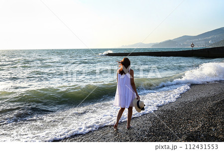 Young woman floating on water in swimming pool Young woman floating on water in swimming pool 112431553
