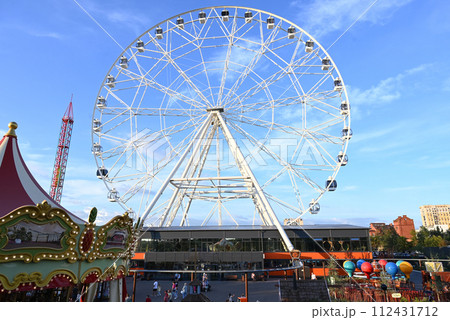 amusement park with ferris wheel 112431712