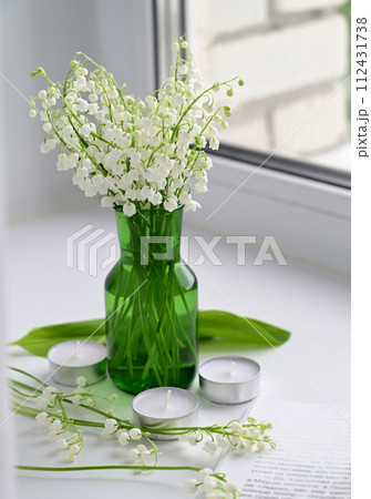 Composition of lily of the valley. Spring concept. A gift to a woman. Composition of lily of the valley. Spring concept. A gift to a woman. 112431738