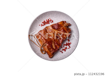 Delicious smoked or grilled ribs with olives, spices and herbs Delicious smoked or grilled ribs with olives, spices and herbs 112432196