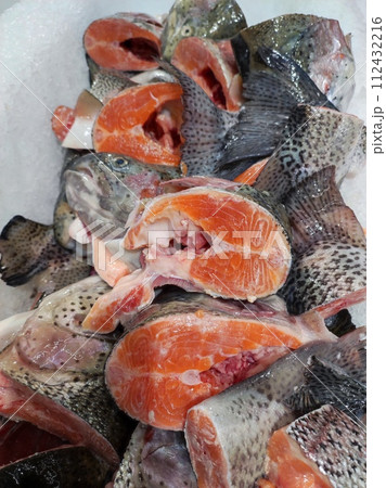 Tails and heads of river trout. 112432216