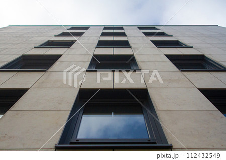 Modern office block with sunny beautiful sky.  112432549