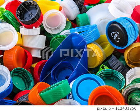 Lots of different plastic bottle caps. Garbage sorting 112433250
