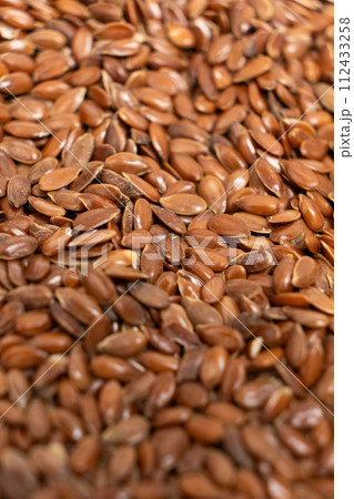 Macro set of flax seeds close-up vertical 112433258