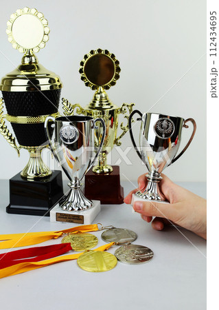 cups and medals for awarding the winners. Sports, competitions. cups and medals for awarding the winners. Sports, competitions. 112434695
