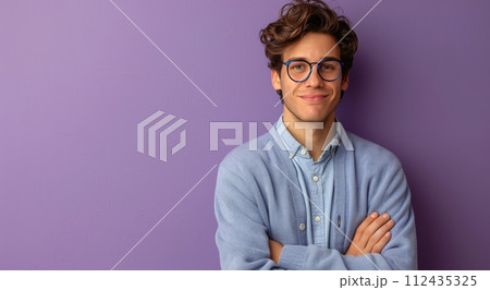 Man Standing in Front of Purple Brick Wall 112435325