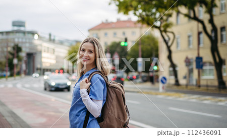 Nurse, doctor walking across city, going to work, hospital, clinic. Work-life balance of healthcare worker. 112436091