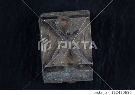 Antique vintage movable type alphabet letter X. 112439656