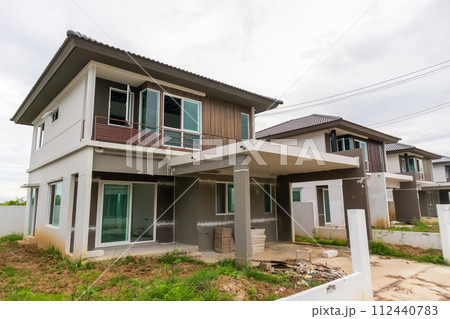 construction residential new house in progress at building site construction residential new house in progress at building site 112440783