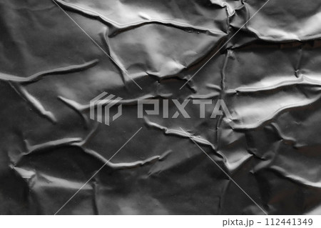 black crumpled and creased plastic poster texture background black crumpled and creased plastic poster texture background 112441349