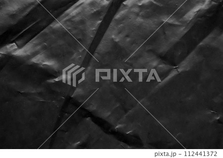 transparent plastic bag wrap overlay texture on black background 112441372