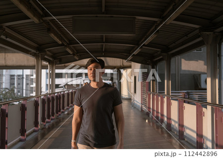 Man is walking on the bridge in the city. Man is walking on the bridge in the city. 112442896
