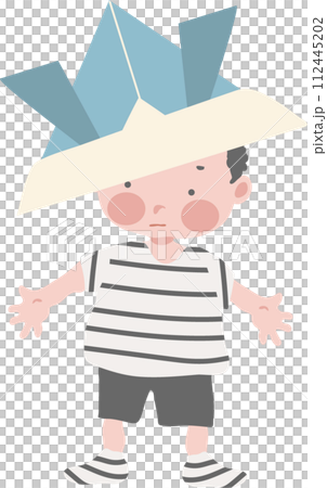 A boy playing with a helmet made from origami 112445202