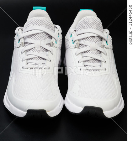 Clean new white pair of shoes 112445450