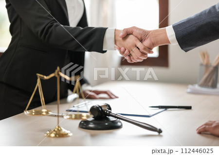 Asian lawyer man working on table office Writing a document, law and justice concept. 112446025