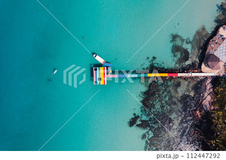 Wooden bridge at the beach and clear blue water Wooden bridge at the beach and clear blue water 112447292