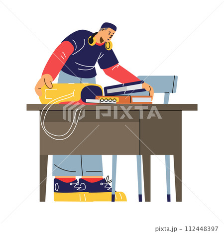 A boy student packs books into a backpack, celebrating the end of his college classes. 112448397