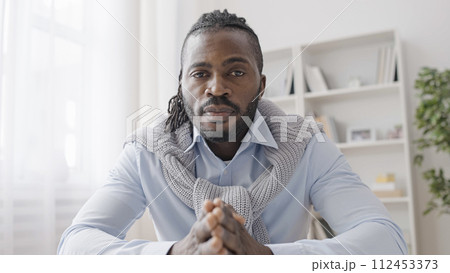 POV of African American businessman listening to colleagues during work video call 112453373