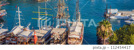 Old town Kaleici in Antalya. Panoramic view of Antalya Old Town port, Taurus mountains and Mediterrranean Sea, Turkey BANNER, LONG FORMAT Old town Kaleici in Antalya. Panoramic view of Antalya Old Town port, Taurus mountains and Mediterrranean Sea, Turkey BANNER, LONG FORMAT 112454417
