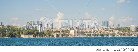 landscape scenery of Dolmabahce palacewith reflection, istanbul, turkey waterfront view from bosporus BANNER, LONG FORMAT 112454472