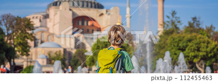 BANNER, LONG FORMAT Boy Tourist enjoy beautiful view on Hagia Sophia Cathedral, famous islamic Landmark mosque, Travel to Istanbul, Turkey. Traveling with kids concept. Sunny day architecture and BANNER, LONG FORMAT Boy Tourist enjoy beautiful view on Hagia Sophia Cathedral, famous islamic Landmark mosque, Travel to Istanbul, Turkey. Traveling with kids concept. Sunny day architecture and 112455463