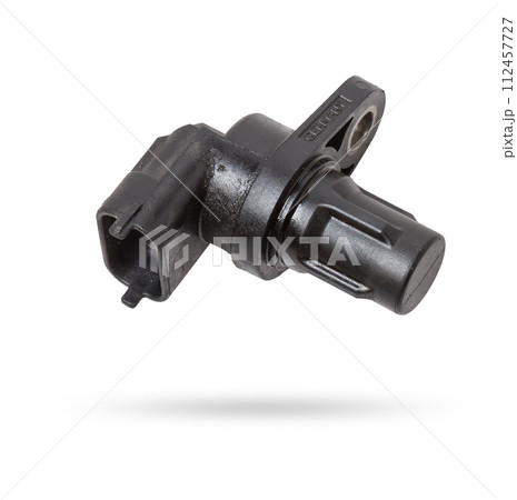 Electromagnetic crankshaft position sensor of a car engine in the hands of an auto mechanic. Spare parts catalog. Electromagnetic crankshaft position sensor of a car engine in the hands of an auto mechanic. Spare parts catalog. 112457727