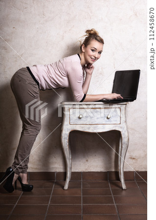 Businesswoman working on computer laptop Businesswoman working on computer laptop 112458670