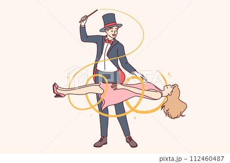 Man magician demonstrates magic trick by making woman assistant levitate during circus performance Man magician demonstrates magic trick by making woman assistant levitate during circus performance 112460487