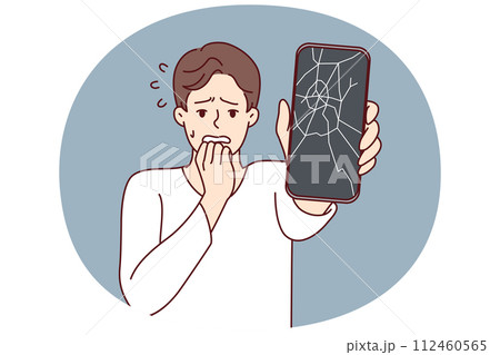 Man reacts to broken phone by bringing hand to mouth and experiencing shock due to breakdown 112460565