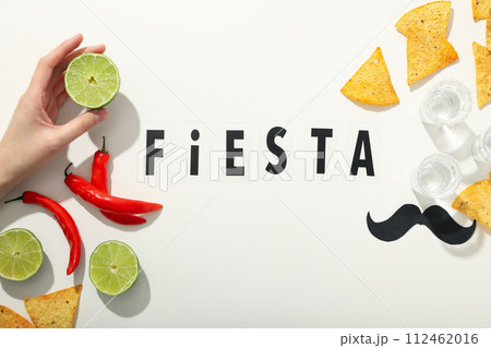 The inscription Fiesta with decorations on a white background The inscription Fiesta with decorations on a white background 112462016