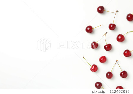 Ripe juicy cherry fruits on a white background 112462053