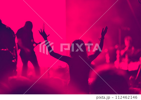 Crowd at a music concert, audience raising hands up Crowd at a music concert, audience raising hands up 112462146
