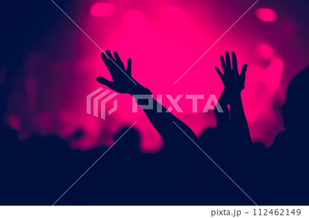 Crowd with outstreched arms at concert Crowd with outstreched arms at concert 112462149