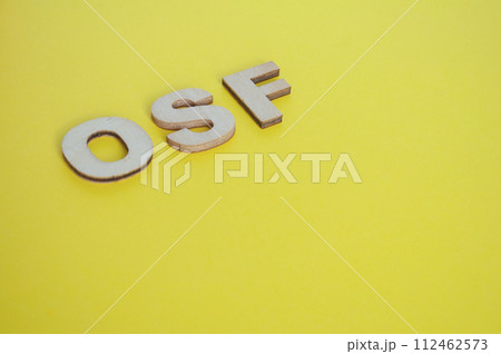 OSF wooden letters representing Open Science Framework on yellow background OSF wooden letters representing Open Science Framework on yellow background 112462573