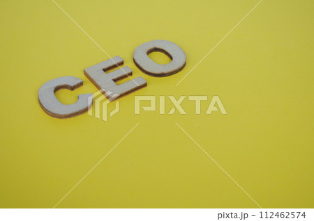 CEO wooden letters on yellow cover background. Senior Executive Level concept CEO wooden letters on yellow cover background. Senior Executive Level concept 112462574