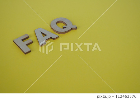 FAQ wooden letters on yellow background. Question and Answer concept FAQ wooden letters on yellow background. Question and Answer concept 112462576