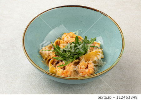 Portion of pappardelle pasta with shrimp Portion of pappardelle pasta with shrimp 112463849