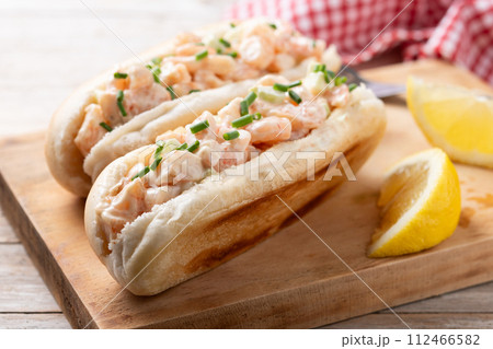 Lobster roll on wooden table 112466582