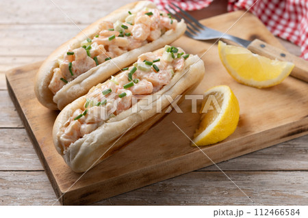Lobster roll on wooden table 112466584