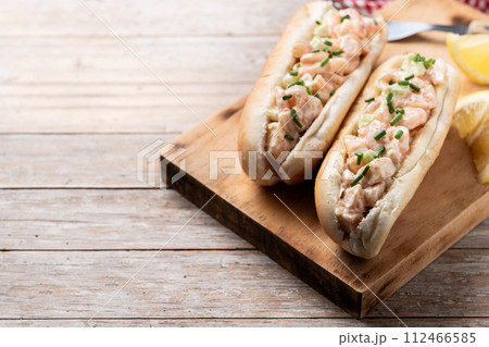 Lobster roll on wooden table Lobster roll on wooden table 112466585