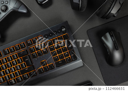 Orange lit keyboard by various wireless gadgets 112466631