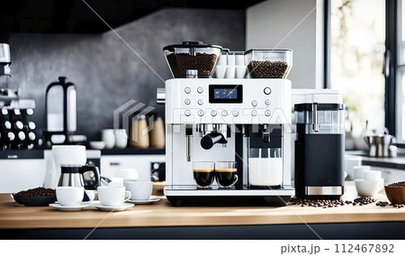 Modern coffee machine with cups on table in kitchen. Modern coffee machine in the process of producing aromatic coffee 112467892