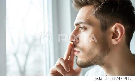 Close-up portrait of a young man with freckles and red beard, confidently looking at the camera 112470919