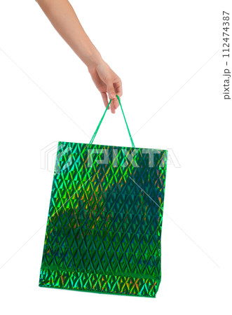 Female hand holding shopping bags 112474387