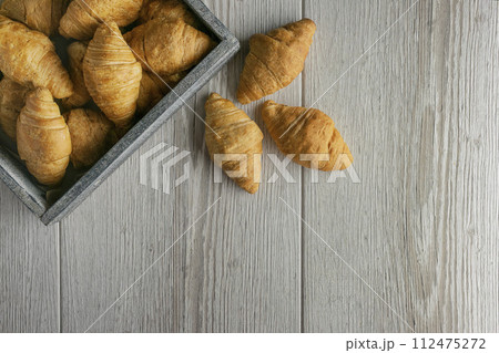 Croissants for tasty breakfast. Original tasty French croissants with cheese and on the table. Croissants for tasty breakfast. Original tasty French croissants with cheese and on the table. 112475272