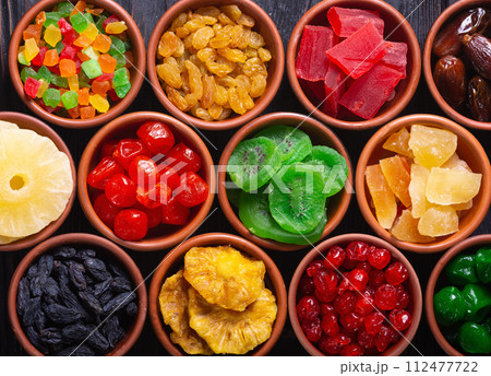 Group of dried and candied fruit in bowl Group of dried and candied fruit in bowl 112477722