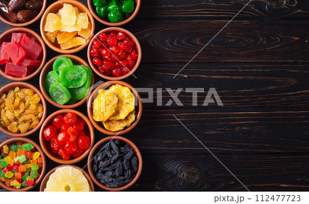 Group of dried and candied fruit in bowl Group of dried and candied fruit in bowl 112477723