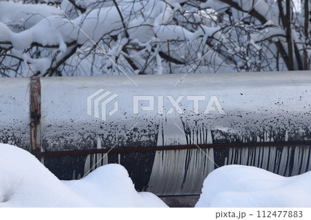 The main provides the city with hot water. Selective focus. The pipes of the central heating system The main provides the city with hot water. Selective focus. The pipes of the central heating system 112477883
