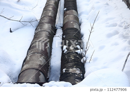 The main provides the city with hot water. Selective focus. The pipes of the central heating system 112477906
