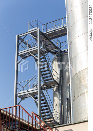 Brewery silos or tanks typically use for storing barley or fermented beer. Brewery silos or tanks typically use for storing barley or fermented beer. 112478024